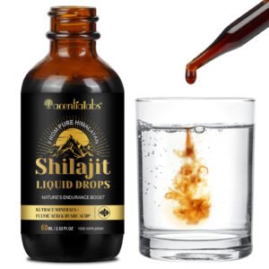 Shilajit bottle next to a glass with dropper